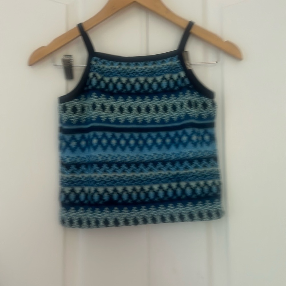 blue tank top with designs